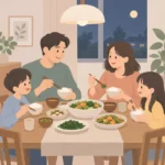 가족 네 명이 함께 식탁에 앉아 채소와 밥이 담긴 그릇을 나눠 먹는 저녁 식사 장면